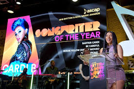 Artist accepting an award on stage